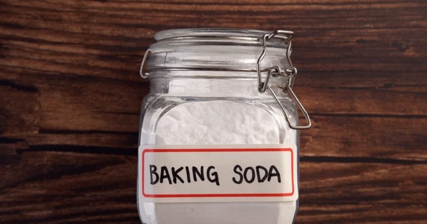 Removing shower caddy adhesive from baking soda